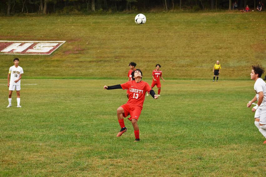 Randy Romero gets in position for a header.