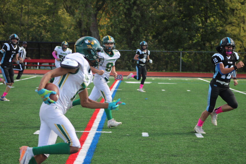 Eldred ball carrier Trai Kaufmann dashes to the endzone on a long pitch and run for the Yellow Jackets. Kaufmann, one of the key performers on the day made plays all over the field on both sides of the ball.