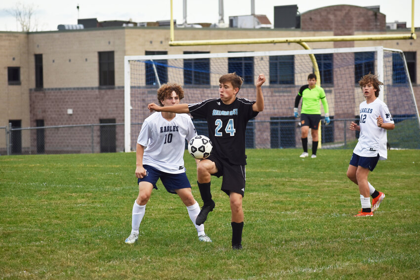 Landen Boyd of Sullivan West stops the momentum of the ball with a well placed knee.