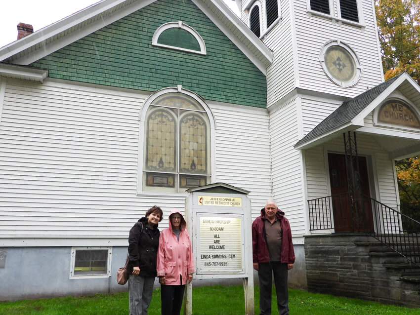 Joining fellow parishoner Judy Durkin, far left, outside the 100-year-old Methodist Church are Linda and Douglas Immoor.