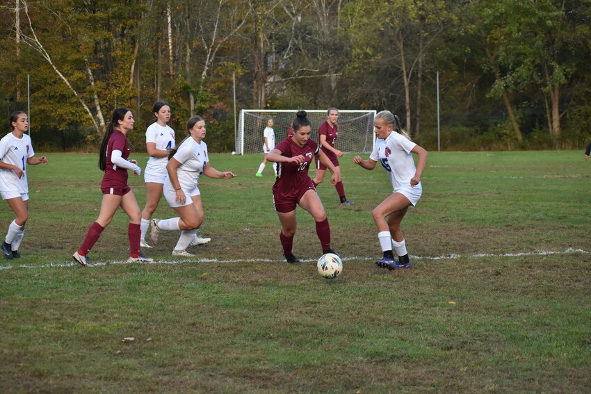 Wildcat’s Rebecca Gashinski cuts through multiple defenders to get in goal range.