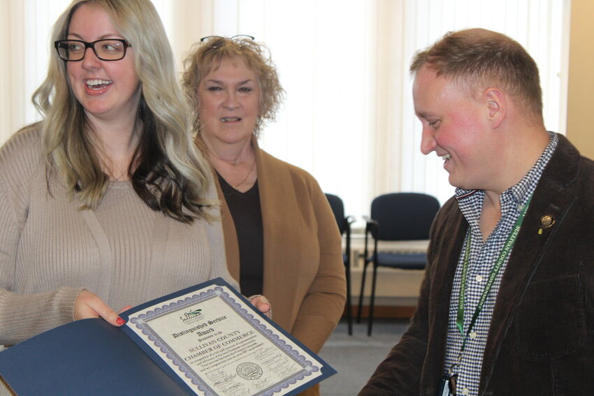 Legislator Matt McPhillips and Sullivan County Chamber President/CEO Ashley Leavitt, left, were all smiles as the Sullivan County Legislature presented the Sullivan County Chamber of Commerce with a Distinguished Service Award in light of their 50th anniversary.
