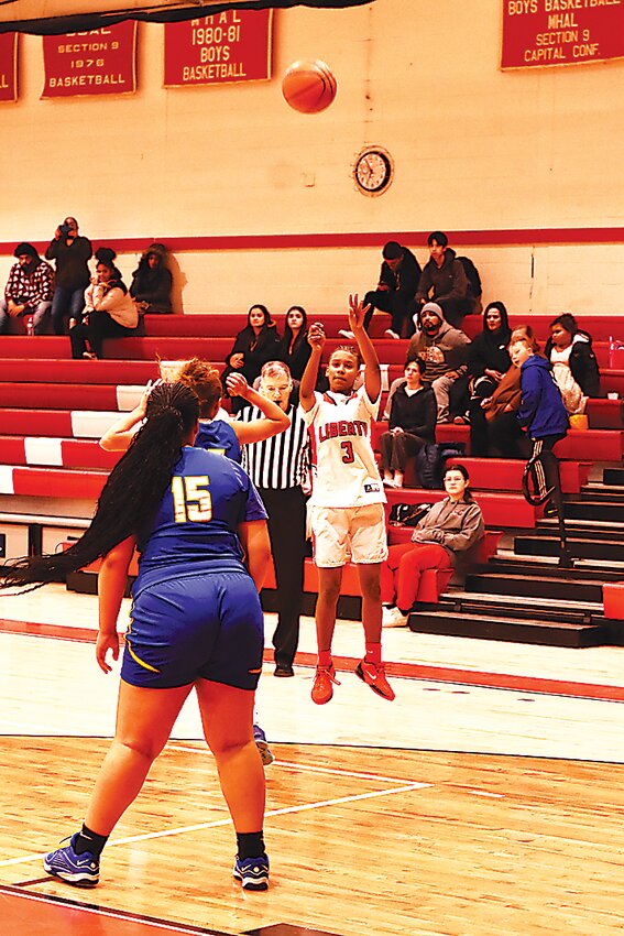 Liberty&rsquo;s Giselle Payton goes for an open three-pointer.