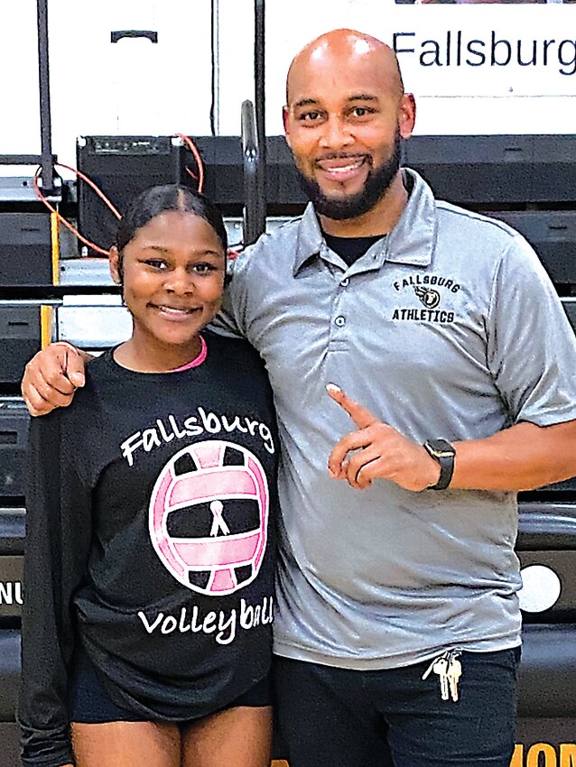 Coach Ballard photographed with his daughter, Maya after a volleyball match. Ballard is the assistant coach for the girls varsity volleyball team.