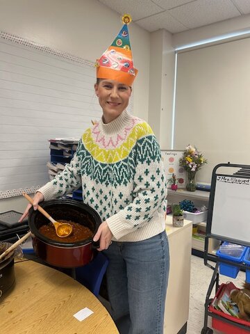 Claire Burns showcasing her winning chili.