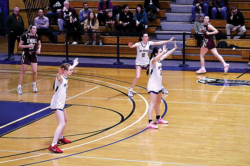 TV's Avery Carrier, Jordan Dymond, and Allyson Chevalier.
on defense in their
Section IX win over
O’Neill.