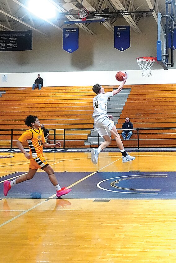 Eldred&rsquo;s Koen McGill rolls it in on a fast break.