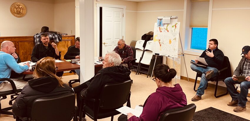 Delaware Engineer Bill Brown, second from right, discusses expanding the tennis courts at the Delaware Youth Center to accommodate pickleball at the recent Town Board meeting