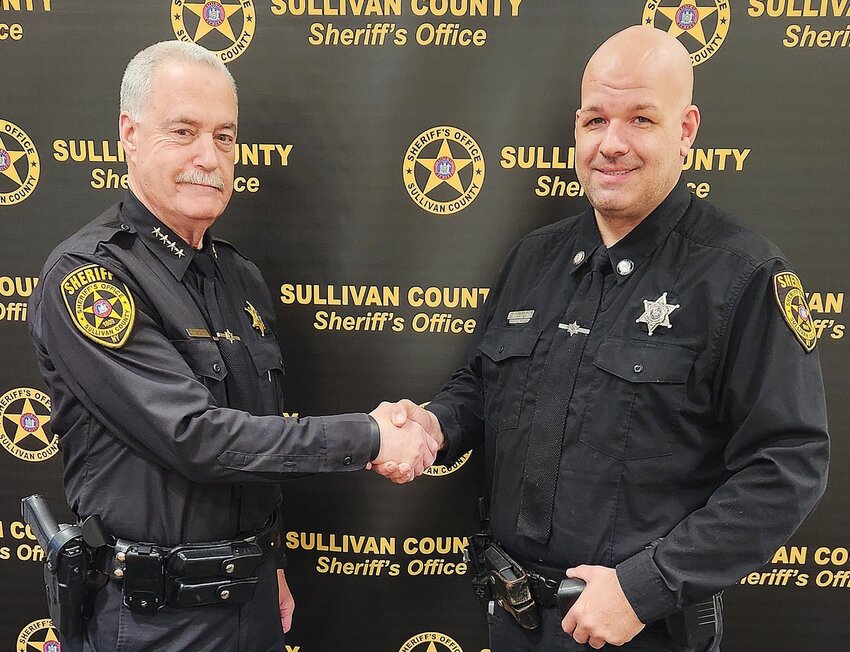 contributed photo
Sullivan County Sheriff Mike Schiff, left,  congratulates Sean Grady on his recent promotion to the rank of Detective. Detective Grady, who has 19 years of service with the Sheriff’s Office, will serve as a uniform Detective in the Sheriff’s Youth Division. He will continue his assignment as a School Resource Officer and investigate crimes reported by school districts.