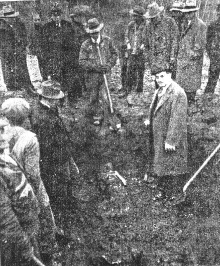 Authorities stand over the unearthed remains of Hyman Yuran in Loch Sheldrake in April, 1940.