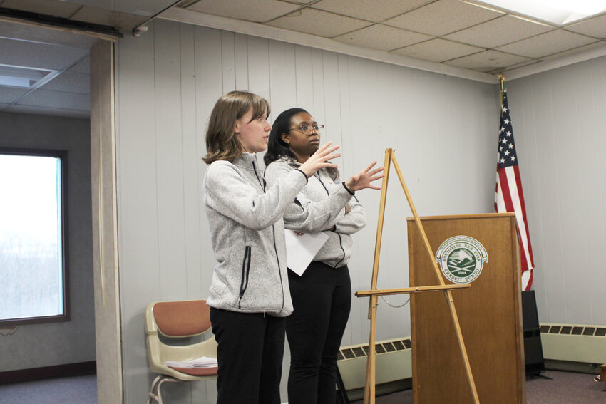 Lily Hassett, left, and Angell Ewane of Laketricity took questions from the Monticello Village Board and residents about their proposed lake-based solar project.