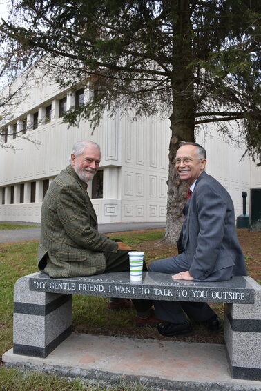 This photo, taken in May of 2017, shows retired SUNY Sullivan professors, Dick Dunn, left and Tom Lambert, during the dedication of “Tom’s Bench” outside of the college under the famous Hemlock tree where Tom mentored many a student. The bench, installed by the Sullivan County Historical Society in honor of the well-respected professor, contained the inscription of Lambert’s famous opening line, which inevitably led to a long and meaningful conversation.