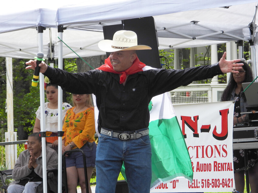 With the Mexican flag proudly displayed on his back, Liberty resident Mauro Dobon offered up his voice to the music on Saturday.