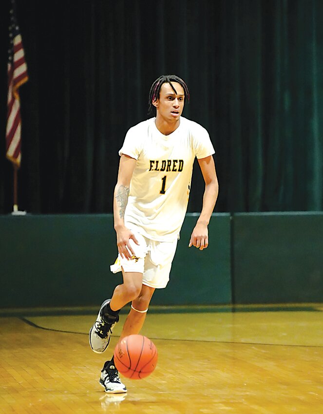Trai Kaufmann bringing the ball up the court during an early-season game. Kaufmann was a fourth team pick and the only player selected from Sullivan County this year to be named to the all-state team.