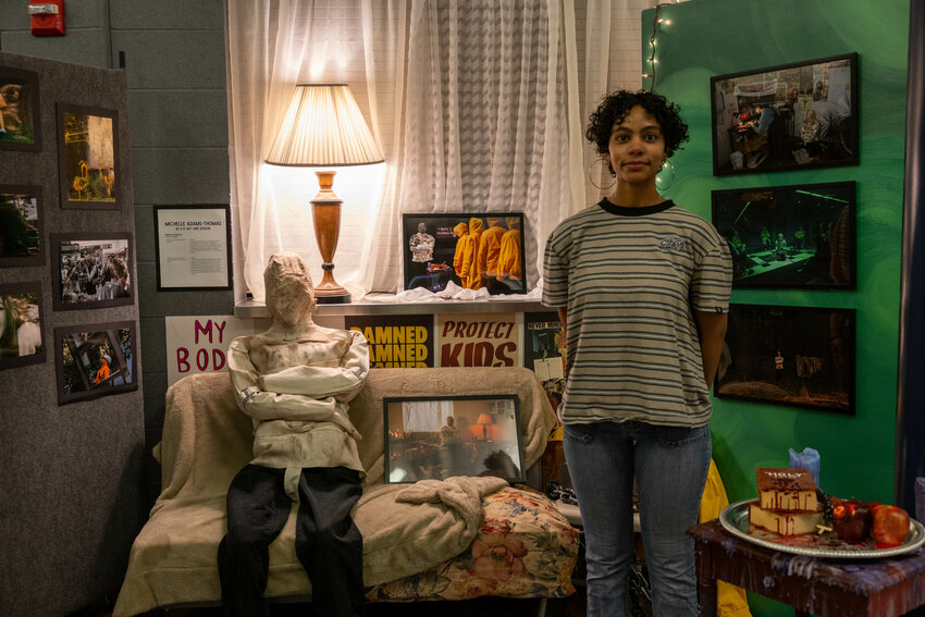 Photographer Michelle &ldquo;Oakley&rdquo; Adams-Thomas with her AP display.