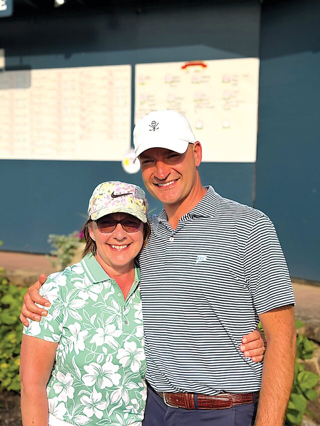 Mom Cindy gives her PGA Professional son Nick a hug following the qualifying round.
