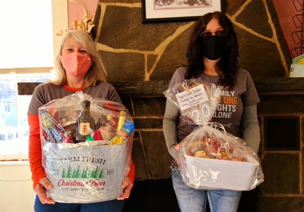 Dolores Bassey of Bethel and Jackie Fahnestock of Greentown, Pennsylvania display two of the thirty themed gift baskets available at the Lois Fahnestock Benefit Raffle Basket and 50/50 Drive-Thru event to be held on Saturday, November 28th at Pecks Market in Eldred. Tickets can be purchased on  the day of the Drive-Thru and  next Saturday November 21st at The Corner Ice Cream Shop in Eldred starting at 11 a.m.