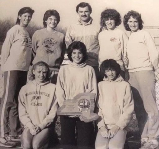 The 1985 Washingtonville Cross-Country Class A State Championship team coached by Charlie Delmonico. His daughter Dee is to his left.