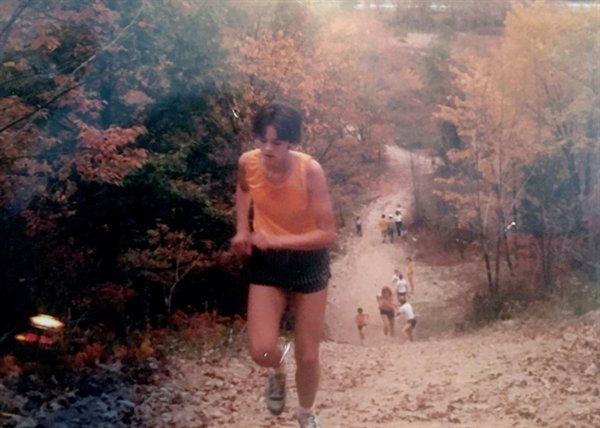 Dee Delmonico Maopolski running up the famed Woodchuck Hill at Washingtonville during her iconic high school running career.