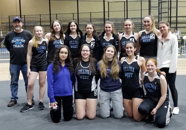 The Sullivan West Varsity Girls and Boys Indoor Track teams celebrate winning Division VI titles. The girls' 149-110 victory over favored Millbrook earned them their seventh straight  title.