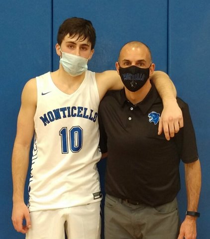 Senior captain Julian Velasco scored a game-high 20 points in his debut as a starter. He was a key reserve a year ago but has stepped right into a leadership role. Coach Christopher Russo puts his arm around his new star after the impressive 71-32 division win over Port Jervis.