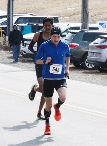Caleb Mallery holds off Vishal Yalamanchili to win the half marathon. Both runners are from Endicott. Mallery now runs for Hartwick College, while Yalamanchili is in his senior year at Union-Endicott High School.