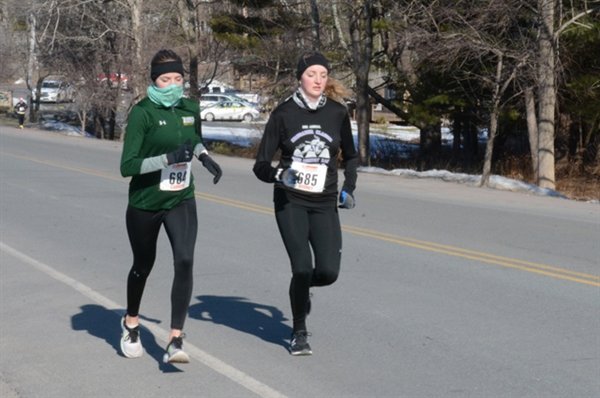 The Johnson twins, Sydney (right) and Camryn, finished 24th and 25th respectively in the half-marathon run. They both had stellar running careers at Monticello High School and Siena College. They're pictured warming up before the race began.