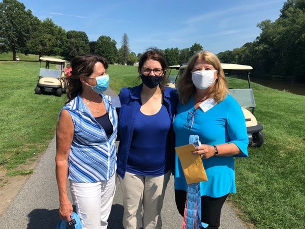 Ginny Brown, Catholic Charities board member, Shannon Kelly, Catholic Charities Deputy CEO, and Susan Murray-Tetz, Catholic Charities board member, greeted golfers and sold raffle tickets to raise much-needed funds for Catholic Charities programs in the community.