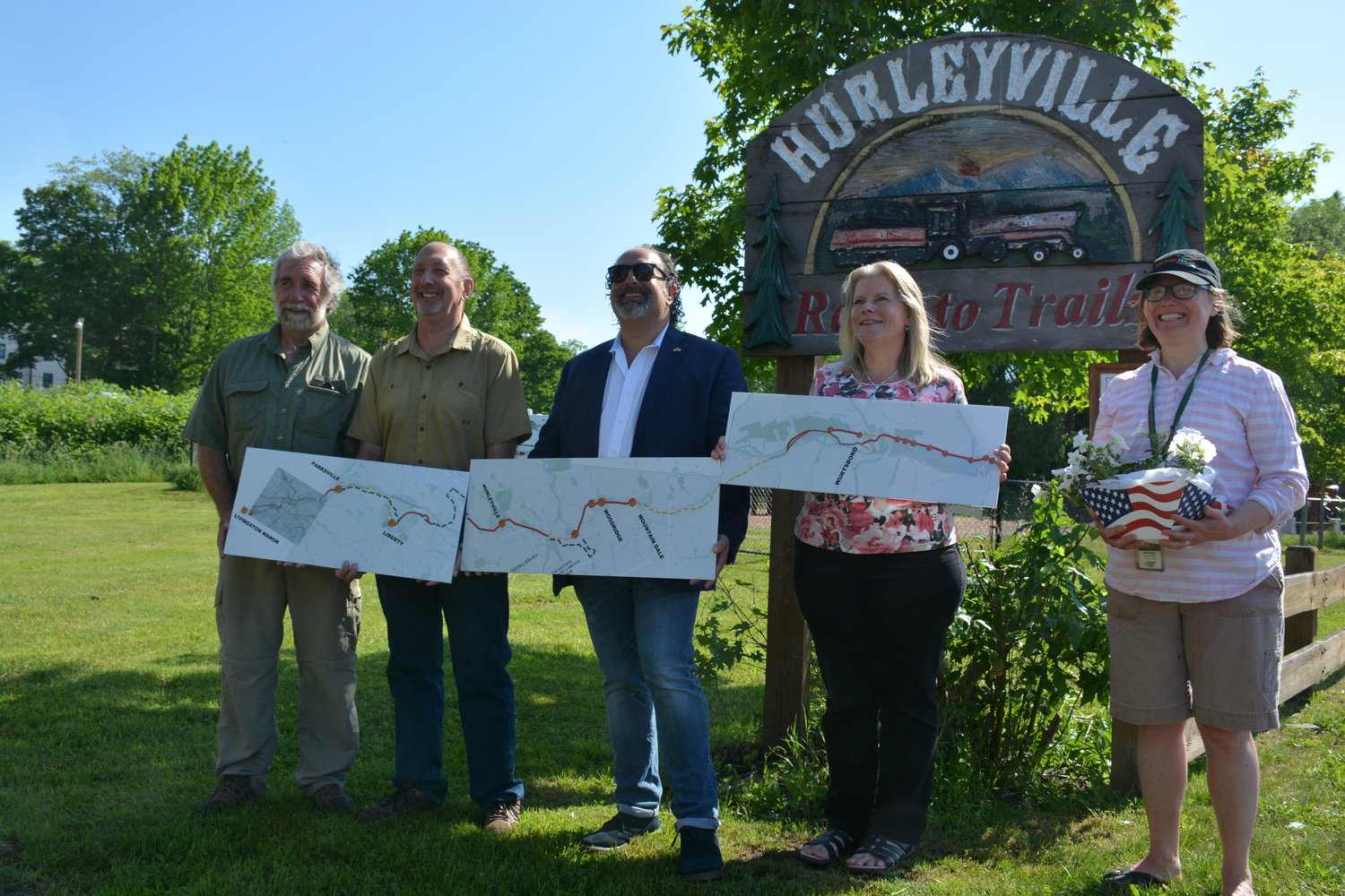 Town Supervisors held up different sections of map representing what the O&W Rail Trail could one day become. From left are Rockland Supervisor Rob Eggleton, Liberty Supervisor Frank DeMayo, Fallsburg Supervisor Steve Vegliante, Mamakating Supervisor Janet Lybolt and Sullivan County Senior Planner Heather Jacksy.