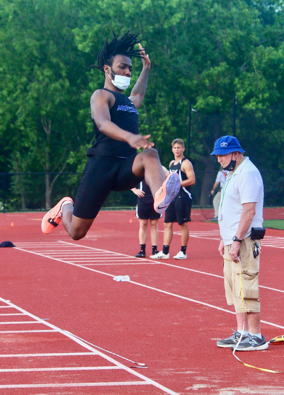 Monticello junior Jivonte Stubbs goes airborne in the long jump to take third place with a leap of 20-4.