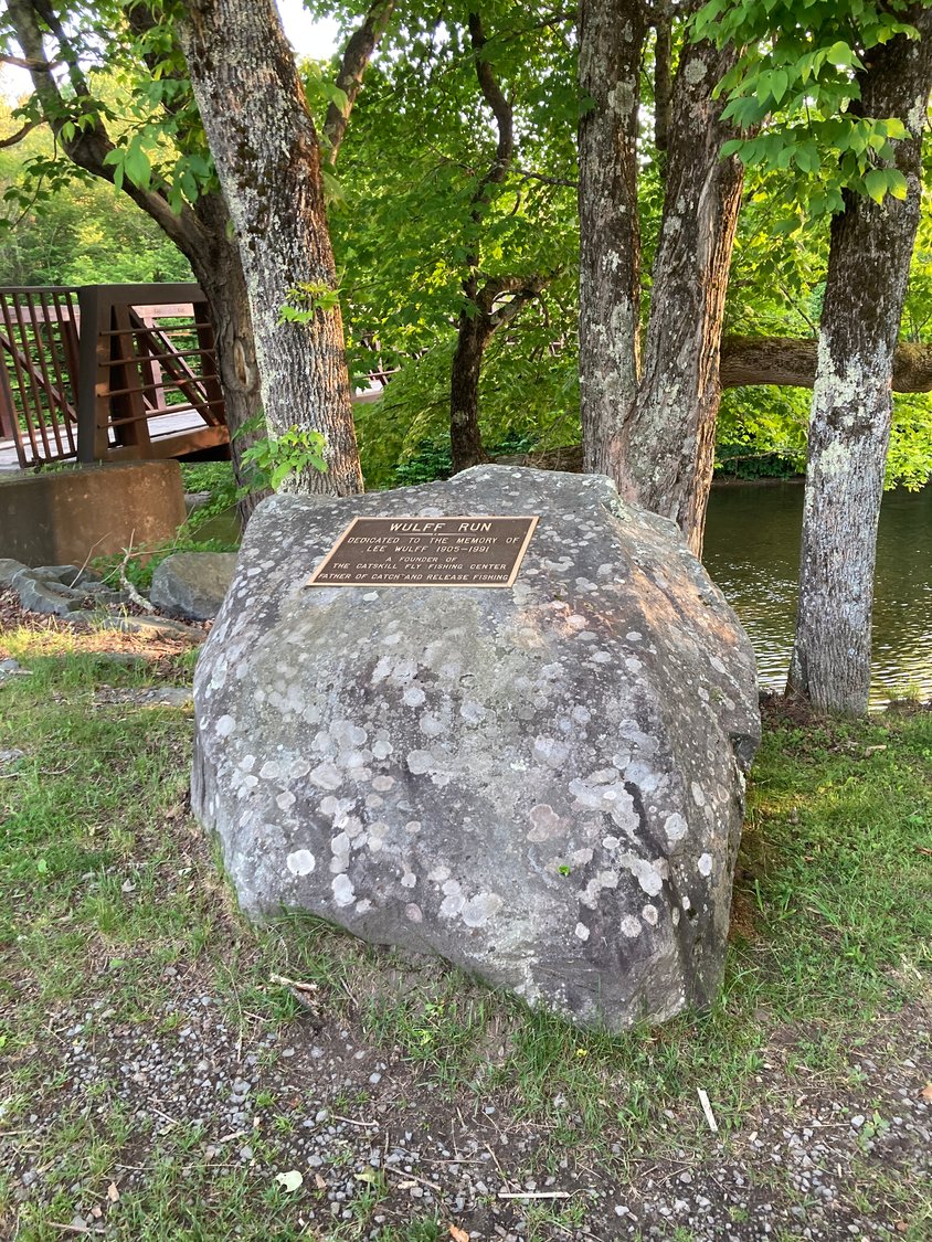 The rock denoting Wulff Run on the Willowemoc is just downstream of the bridge leading to the CFFC&M. Name plates of those who donated toward the purchase of the bridge are affixed to the steel arches.