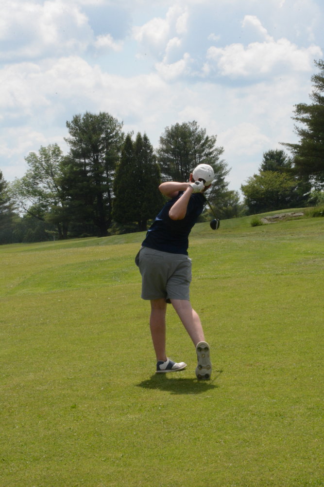 Clarke tees off on Swan Lake’s first hole. 