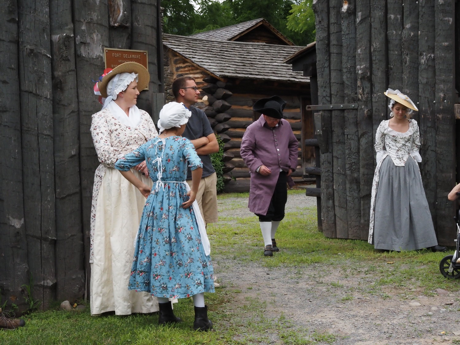 Katrina Chellis, left, and her daughters Mary and Elizabeth, dressed in 18th century style gowns, await the courier from Philadelphia (portrayed by John Conway).