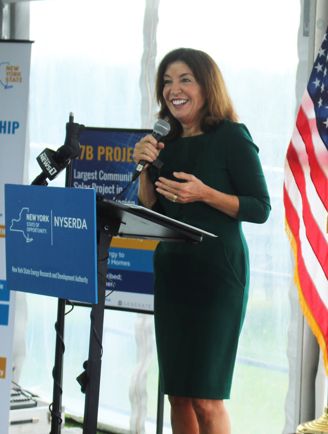 Lieutenant Governor Kathy Hochul said that thanks to solar projects like the one pictured behind her, New York State is halfway to its stated goal of producing 6 Gigawatts of solar energy by 2025.