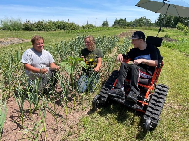 Jay joins Anthony and Carly in the fields, using an adaptive Action Trackchair to get around at Hope Farm, a 3-acre working organic farm.