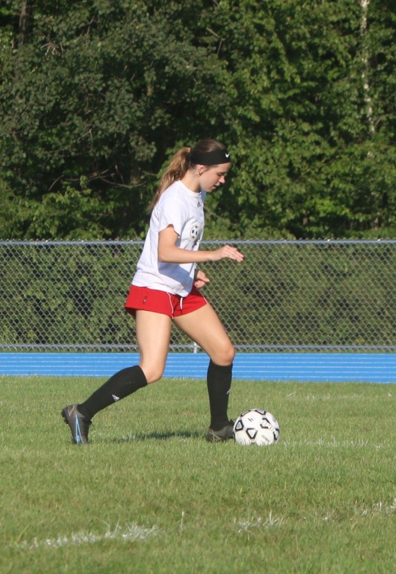 Sullivan West's Grace Boyd passes the ball in a circle drill on the second day of practice.