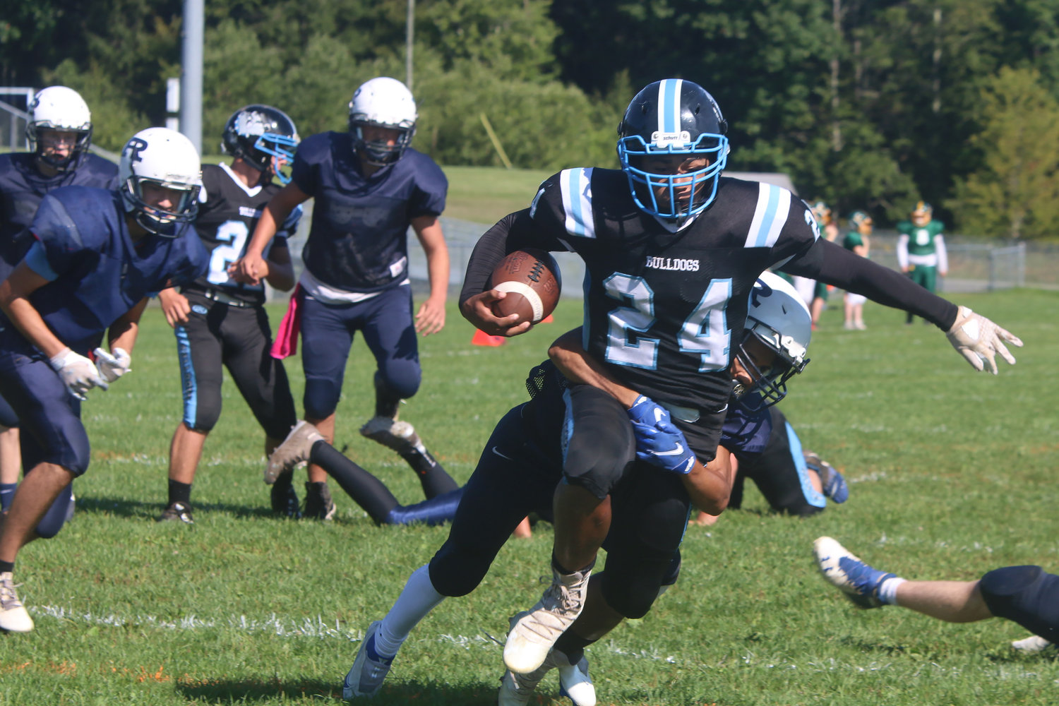 Sullivan West’s Tarrell Spencer fights through a Spackenkill defender for extra yardage.