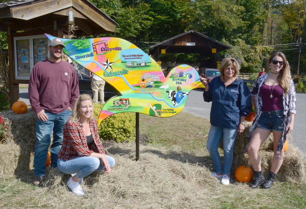 The newest dove in the Sullivan Catskills resides at the Grahamsville Fairgrounds. Designed by Kim Simons, the dove was unveiled at Saturday’s event. Pictured from left are Neversink Agricultural Society’s John Garigliano and Jessica Doyle, Sullivan Catskills Visitors Association President/CEO Roberta Byron-Lockwood and Neversink Agricultural Society’s Nicole Gorr, who is also a town councilman.