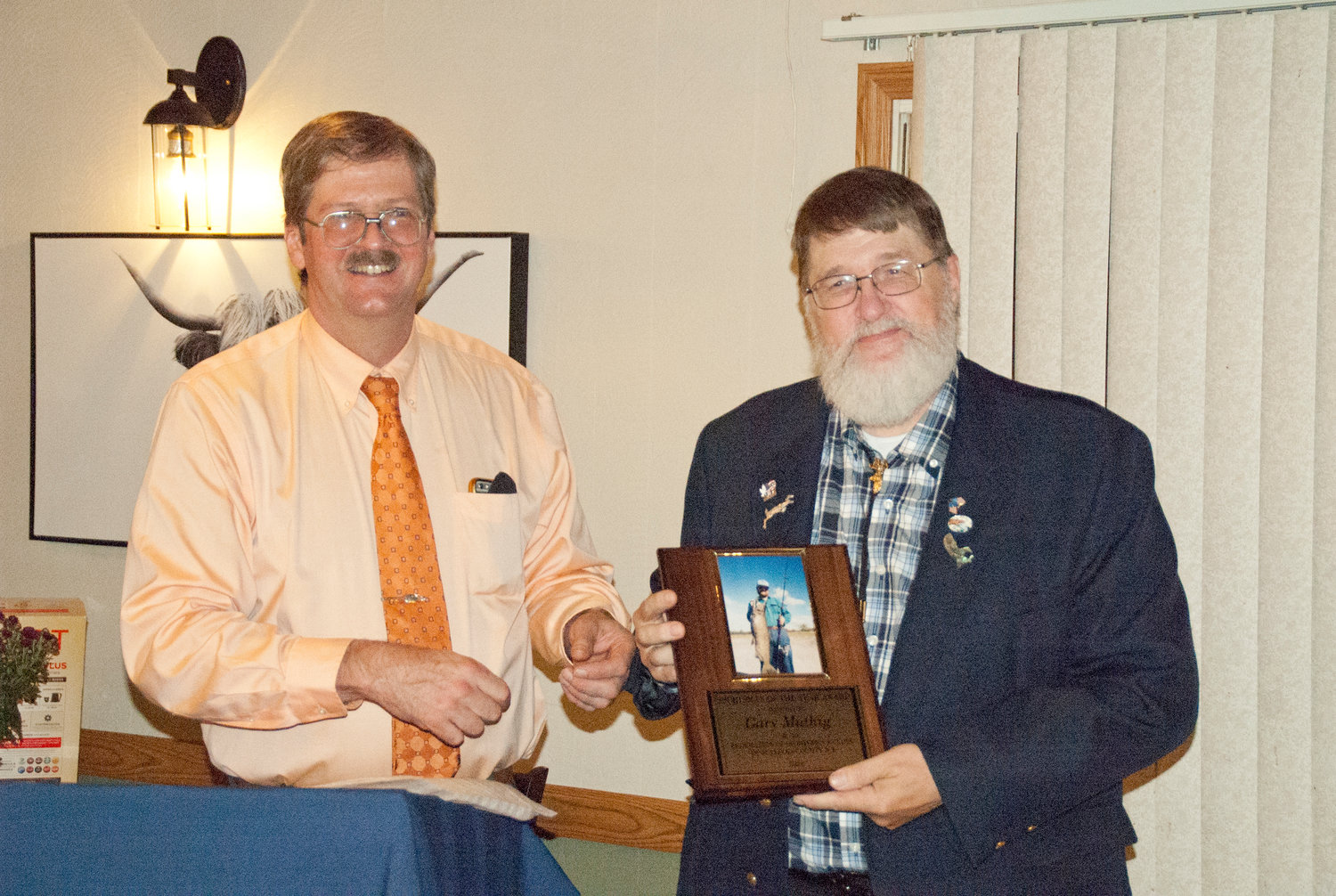 Federation President John Van Etten (Left) presents Sportsman of the Year winner Gary Muthig with the award at their annual dinner at the Rockland House.