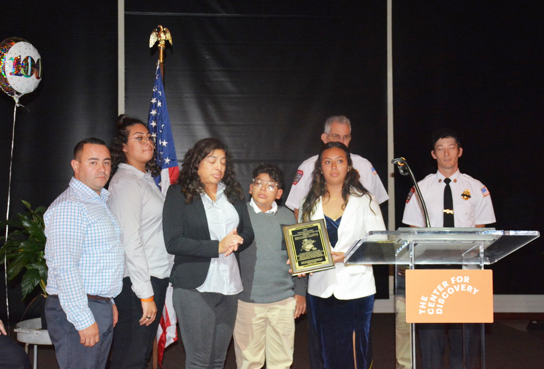 The 2020 Harry Shapiro Fire Police Officer of the Year Award was given to the late Benjamin Santos. Accepting the award on his behalf were several members of the Santos family.