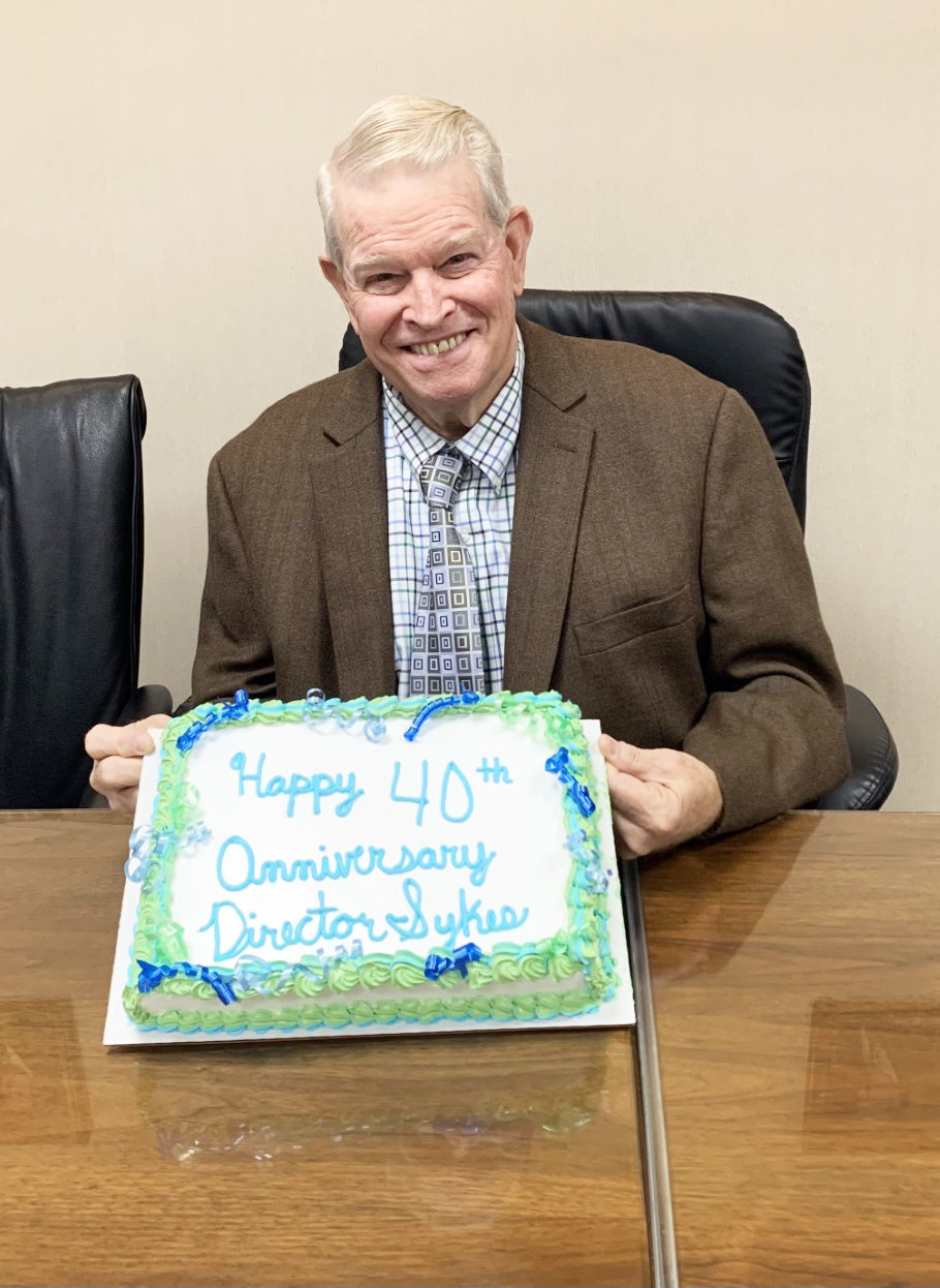 Ed Sykes was recently honored with a cake for serving on the Jeff Bank Board of Directors for 40 years.