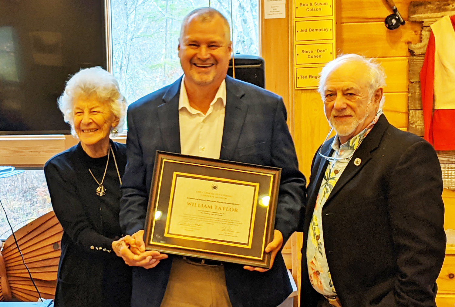 John Taylor (center) accepts the 2021 Hall of Fame award on behalf of his great uncle William Taylor, Presented by Joan Wulff (left) and Ted Patlen at the Catskill Fly Fishing Center and Museum ceremony.