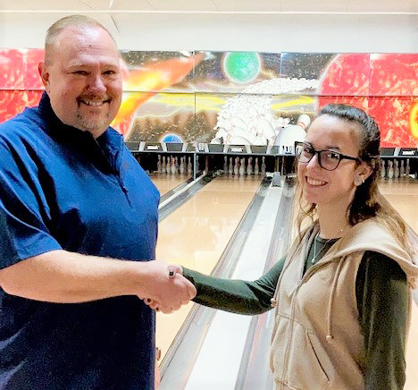 Brigette Willis, right, owner and manager of Port Jervis Bowl, welcomes Paul Minton, President of the new Monday Night Mixed league which consists of bowlers from three leagues that formerly bowled at the now closed Kiamesha Lanes.