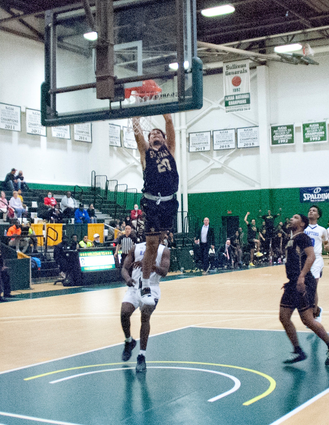 Jay Alvarez gets up and slams home a dunk on a fast break. The Generals won their season opener 80-55.
