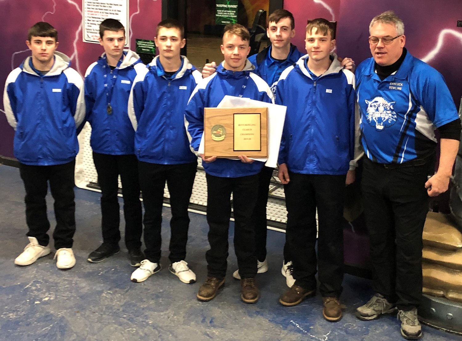 Bill Gleim, right, owner and manager of the Hancock Fox Bowling Center coaches the members of last year's Hancock Central's high school youth bowling team. Previous youth members have brought home Sectional Championships.