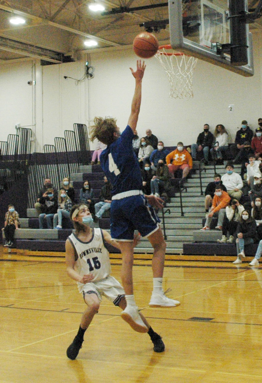 Ben Ackerly reaches towards the rim for a fast break layup in the second half in a win over Downsville.