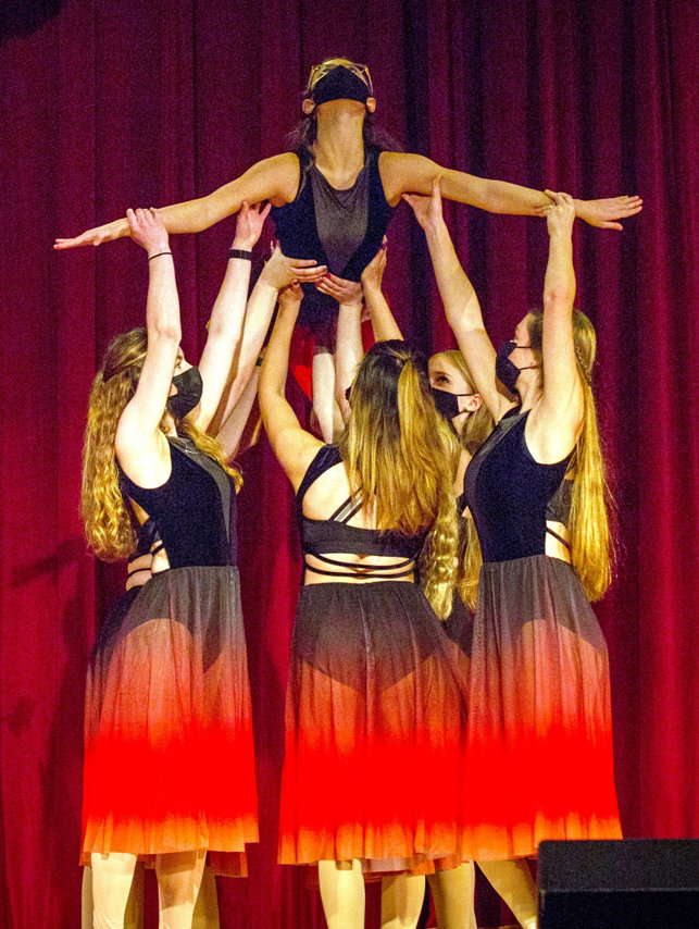Arieanna Hinkley is lifted up by her fellow Elite Lyrical dancers.