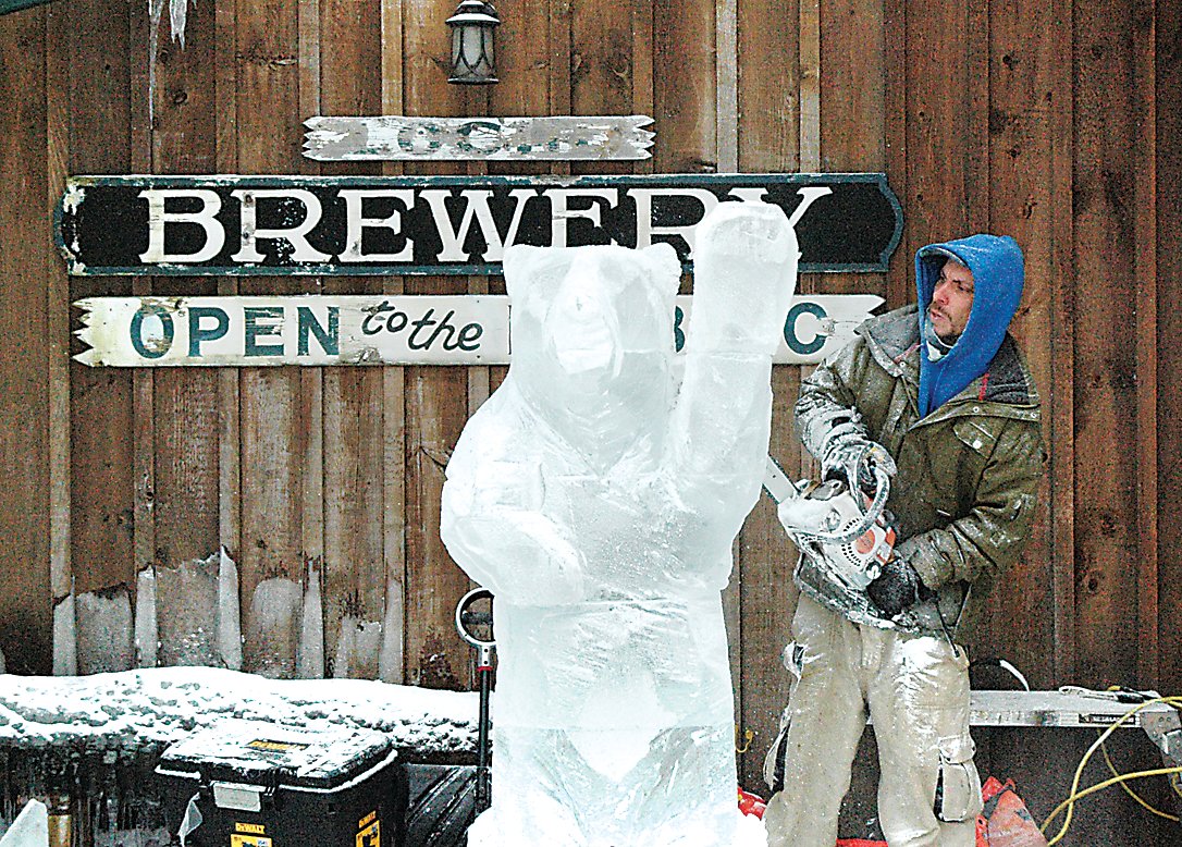 Eric Polick of Stump Devils Wood Carving based out of Woodbourne masterfully crafts an ice sculpture in the image of a bear to commemorate one of the many beers on tap at Roscoe Beer Company titled the Raging Bear.