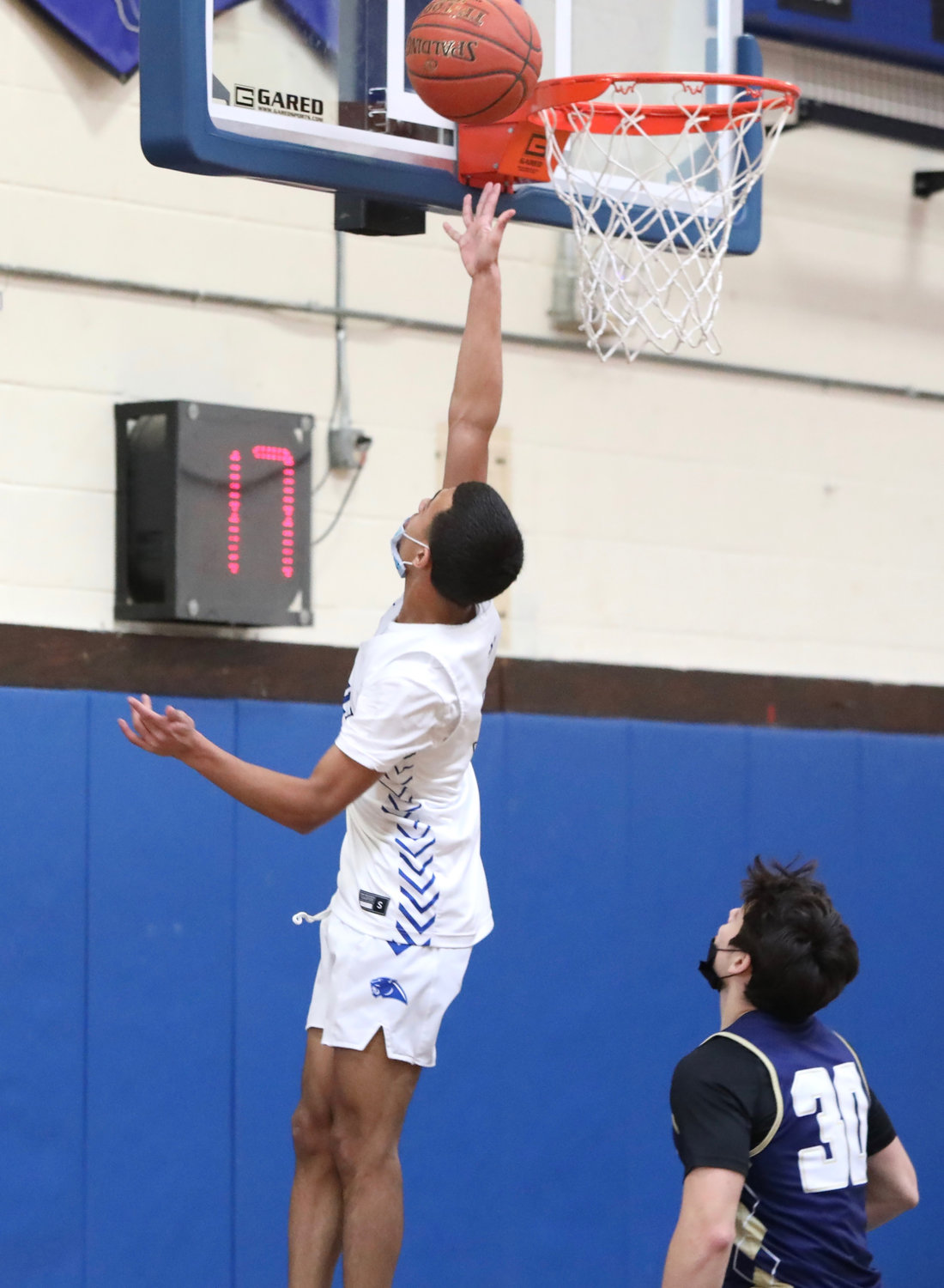 Monticello senior captain Pedro Rodriguez slashes to the rim with two of his game-high 25 points that included a pair of threes and hitting seven-of-eight from the stripe. He had 10 of Monticello’s first quarter points as they jumped on the Bulldogs 15-3 by the end of the quarter.
