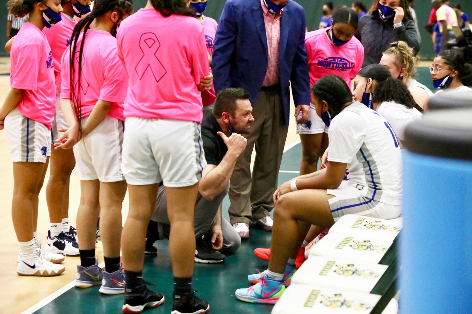 Monticello girls’ coach Ryan Jasper emotionally manifests his displeasure during a timeout as his talented and unselfish team squanders an early lead by seemingly forgetting much of what they have learned to date.